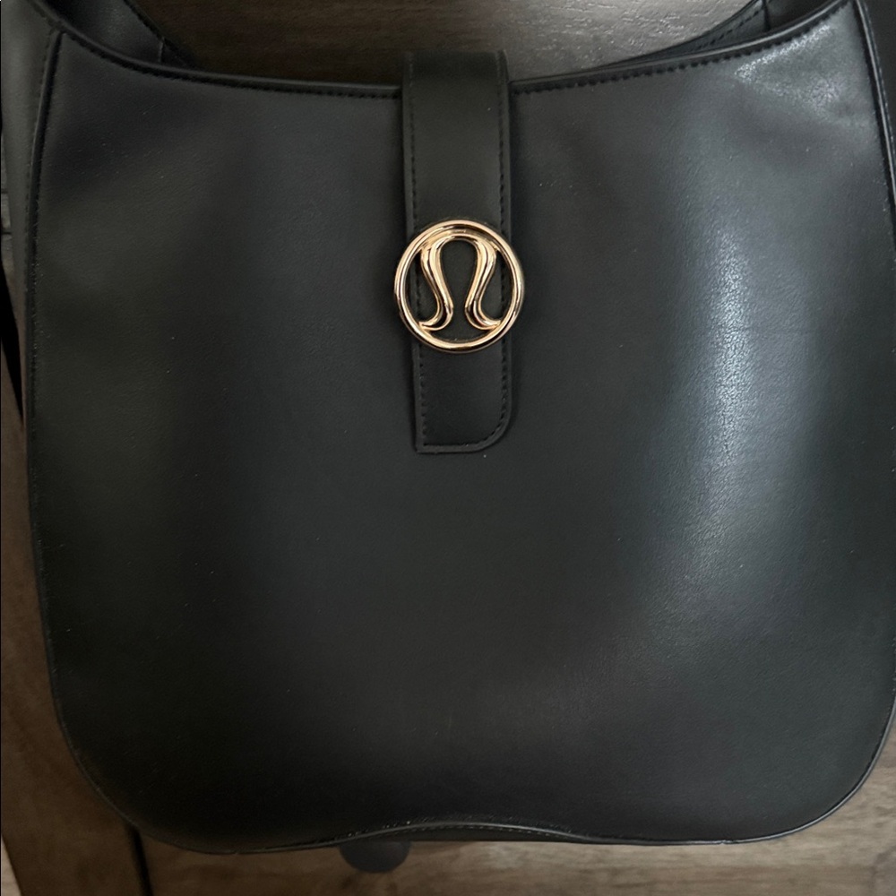 lululemon athletica Black Shoulder Bag with Gold Accent